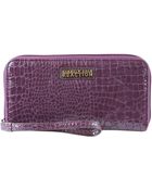 Kenneth Cole Reaction Pda Zip Around Wristlet - Lyst