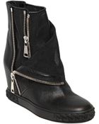 Casadei 90Mm Perforated Leather Wedge Boots - Lyst