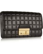 Michael Kors Gia Quilted Leather Clutch - Lyst