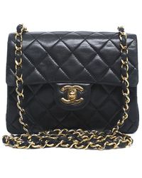 Chanel Pre-Owned Black Lambskin Vintage Mini Flap Bag - Lyst