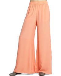flared crepe pants bcbgeneration marcel trousers orange lyst chine