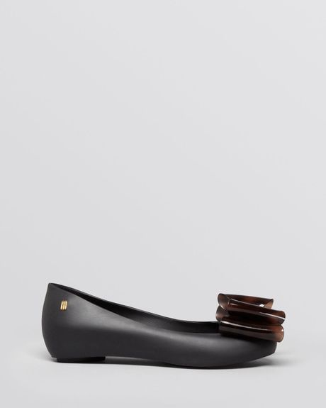 black jelly ballet flats