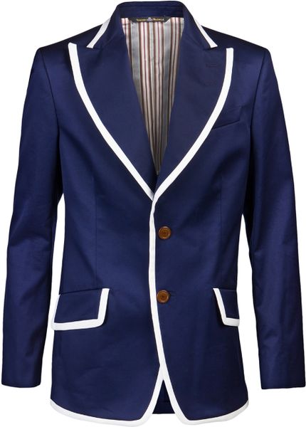 Shop by category Notes. Navy blazer with cream grosgrain trim. Handmade in New York. % year-round wool flannel. 3-roll-2 silhouette. Three patch pockets. Cream grosgrain trim on edge of blazer and top edge of pockets.