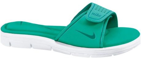white and teal nike slides