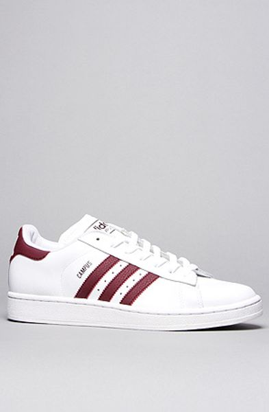 white adidas with maroon stripes