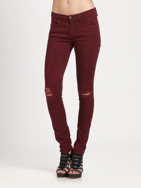 red ripped pants