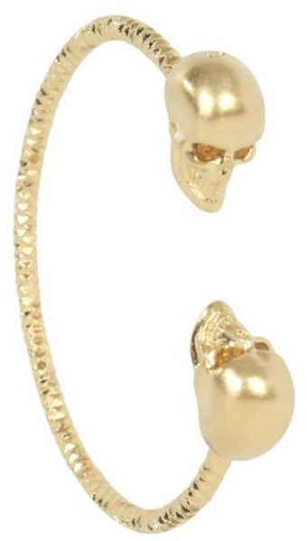Alexander McQueen Goldamber Twin Skull Bangle - Lyst