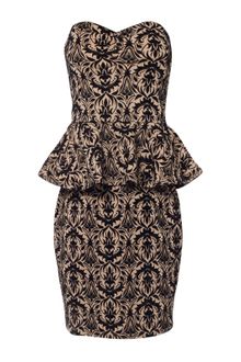 Jane Norman Flock Peplum Dress - Lyst
