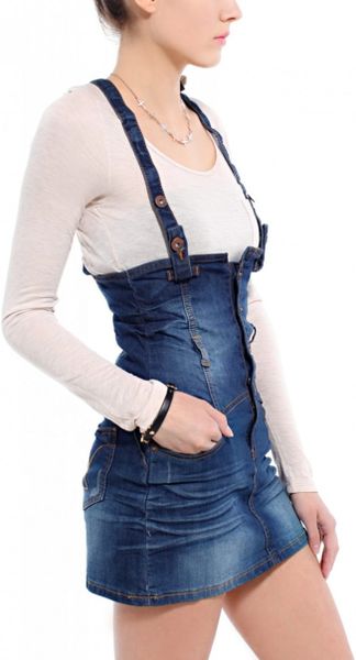 Blue jean overall skirt Like jeans, the denim jumpsuit is a go-to for parents and caretakers who want an easy-going wardrobe that makes dressing her a breeze. For older girls, this is the type of staple piece that she'll wear over and over, for school, the weekend and beyond.