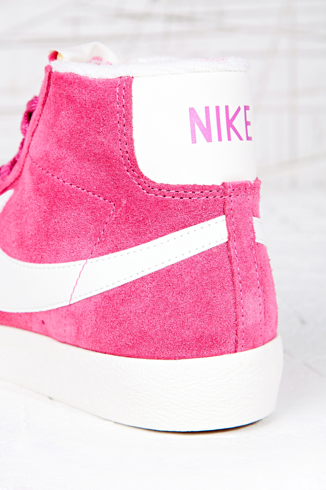 pink and white nike high tops