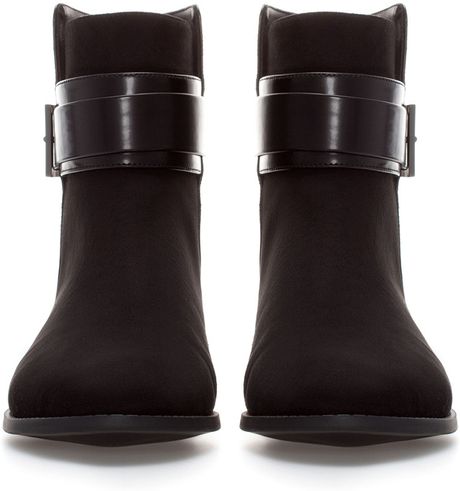 buckle flat ankle boots