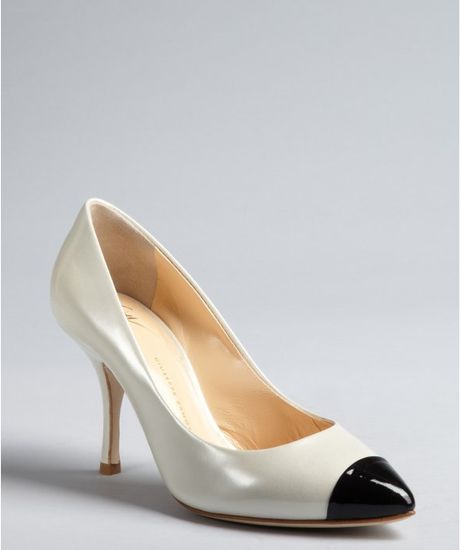 black pumps with white cap toe
