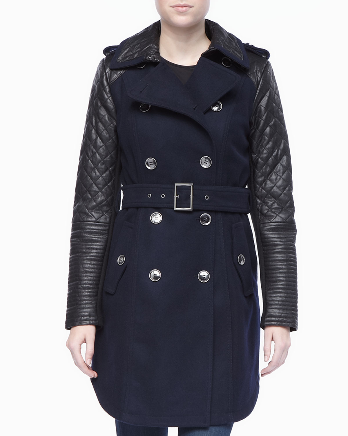 Leather sleeved trench coat You can show your hardcore side when you have a trench coat like this one in your repertoire. Long sleeves are accented with leather up to the shoulders and into the lower part of the collar.