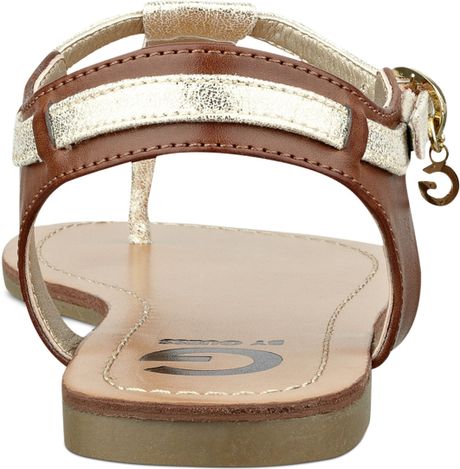 ... By Guess Womens Luzter Tstrap Flat Thong Sandals in Gold (CognacGold