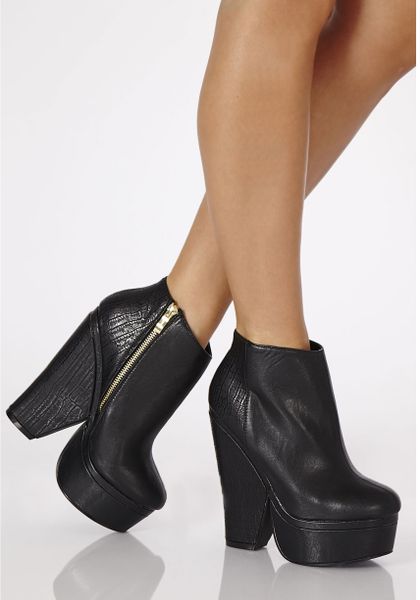 black snake print heeled boots