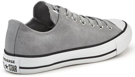 white and grey leather converse