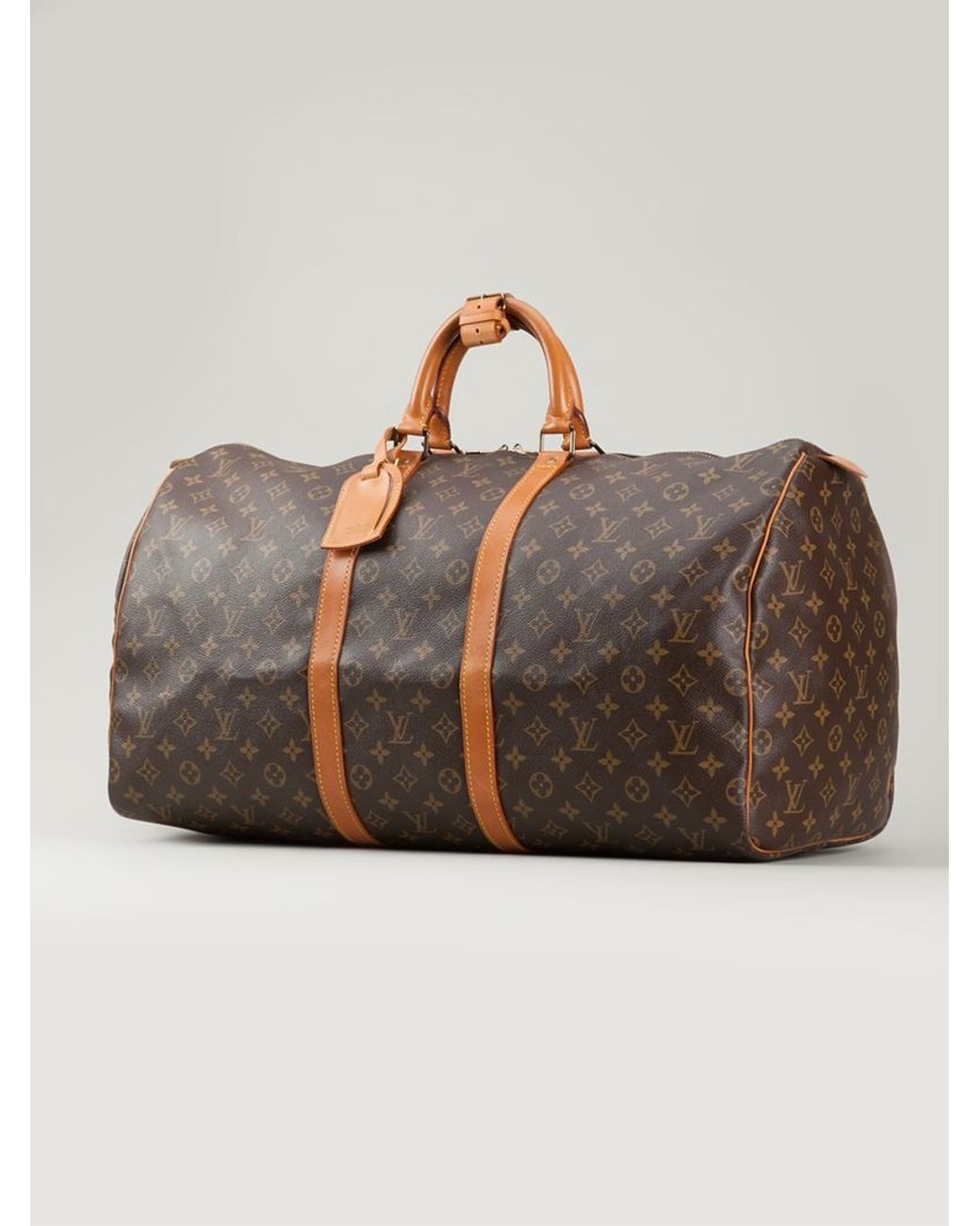 LOUIS VUITTON. Travel bag Keepall model in brown canvas …