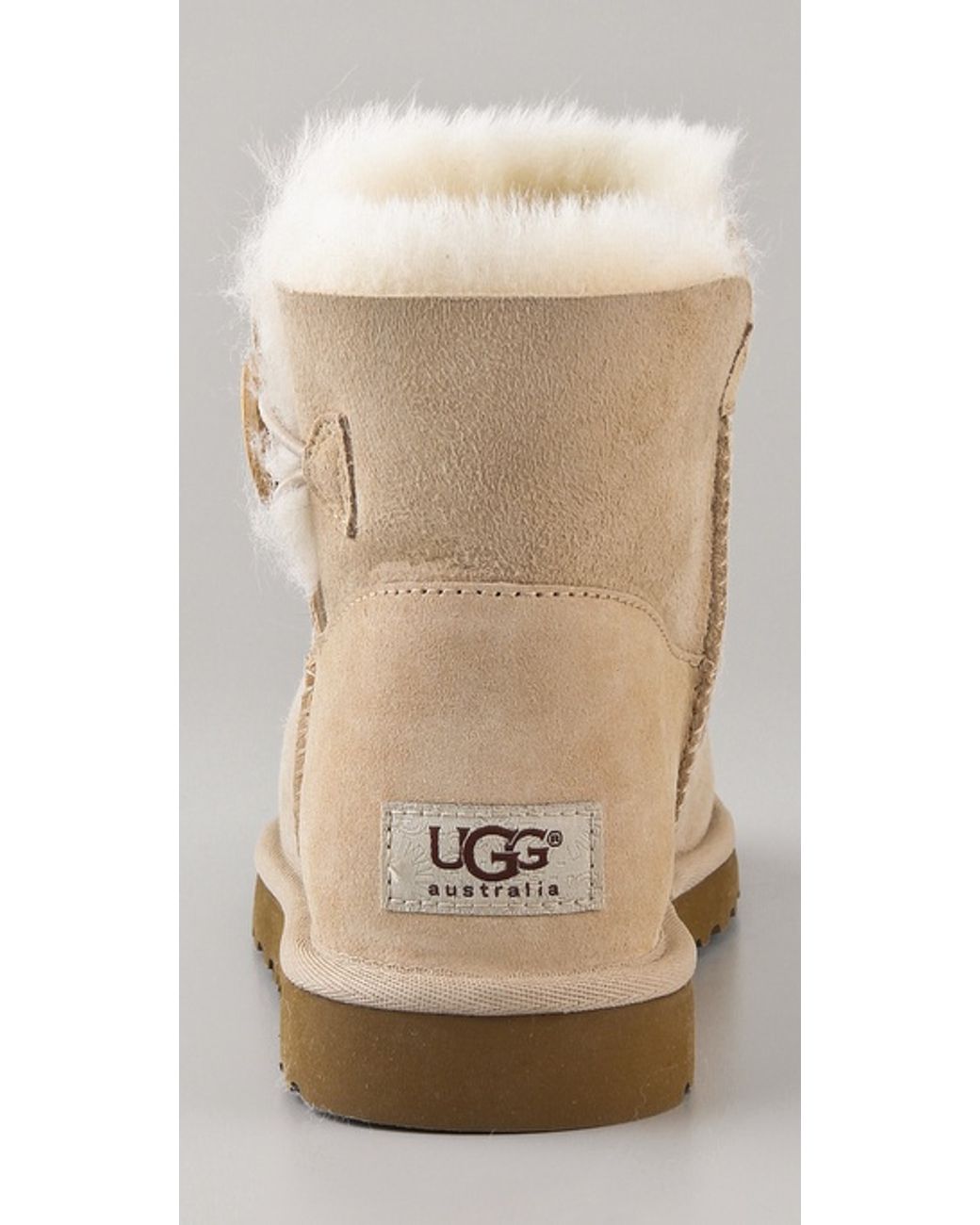 UGG Mini Bailey Button Booties in Natural | Lyst