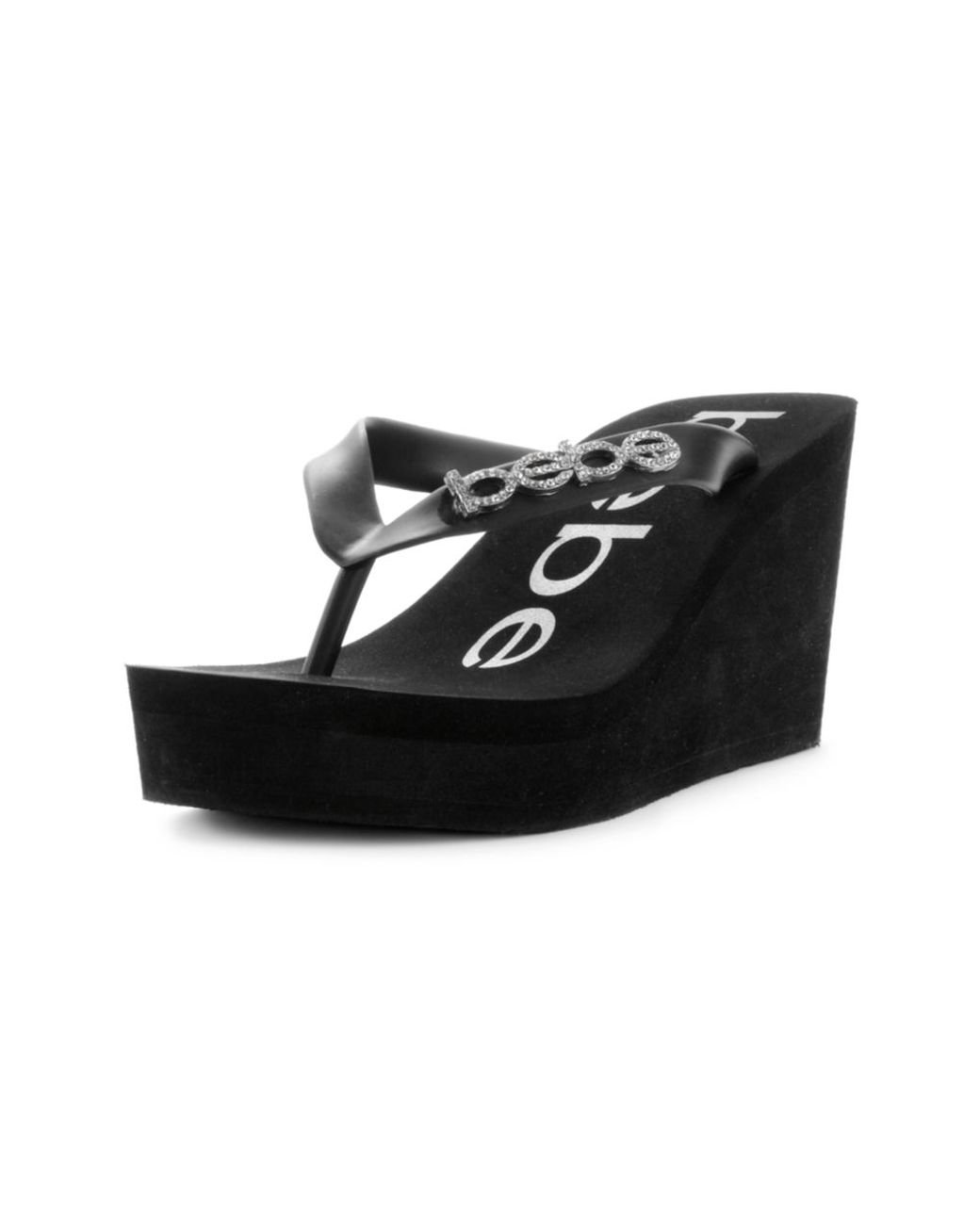 Bebe Kristy Wedge Flip Flop Sandals in Black | Lyst