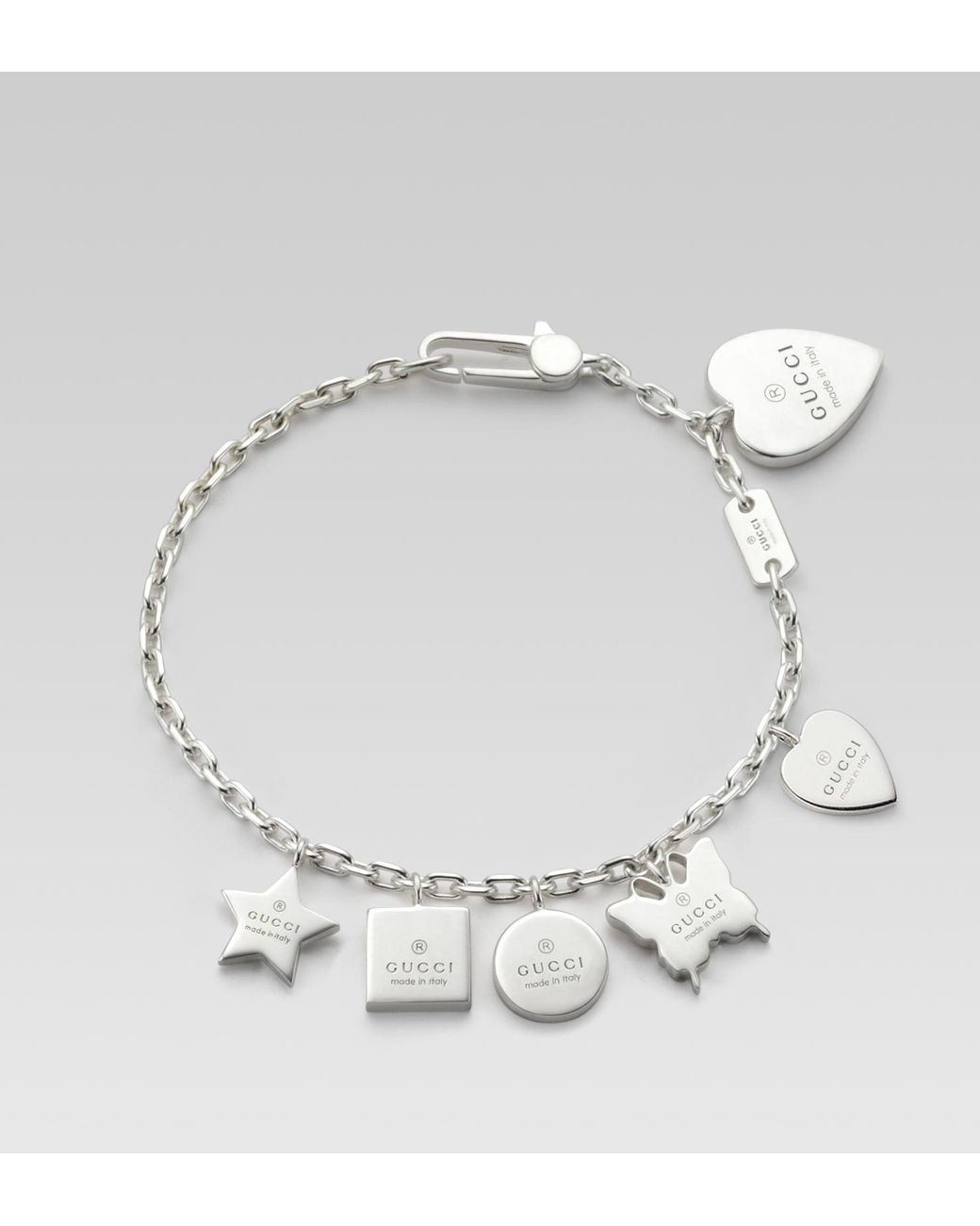 Gucci Bracelet with Gucci Trademark Engraved Charms in Metallic