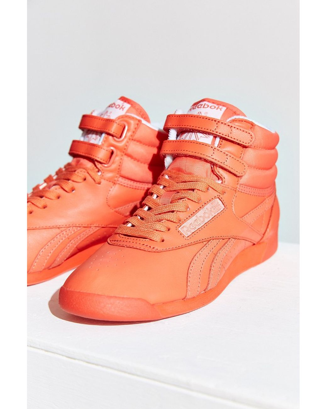 orange high top reeboks