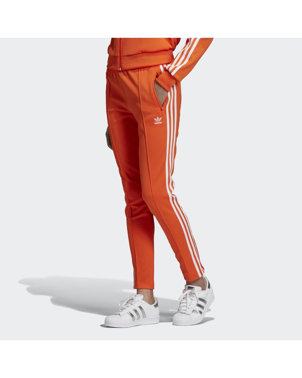 Snoep Pluche pop subtiel adidas Sst Trainingsbroek in het Oranje | Lyst NL