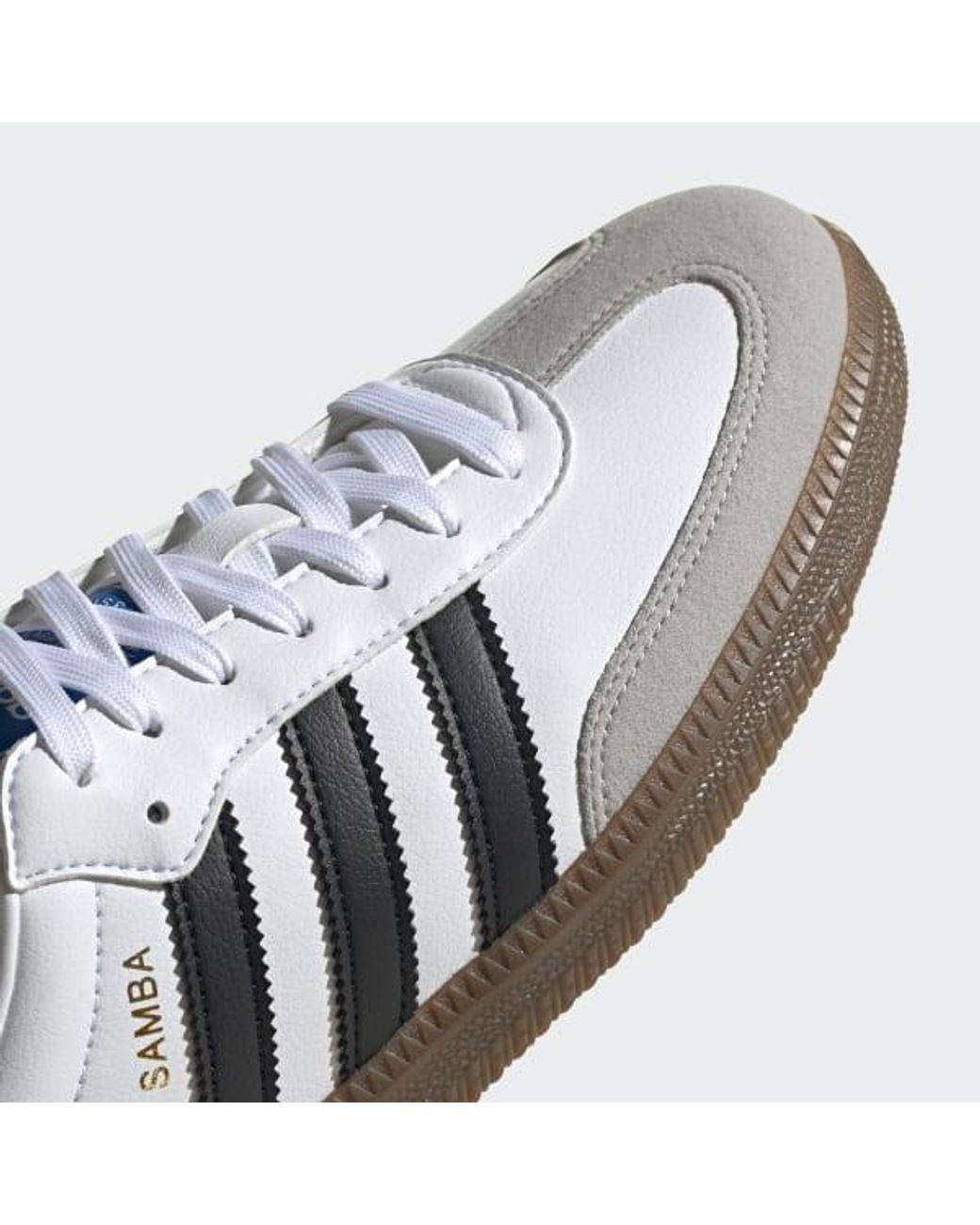 adidas white shoes with red stripe