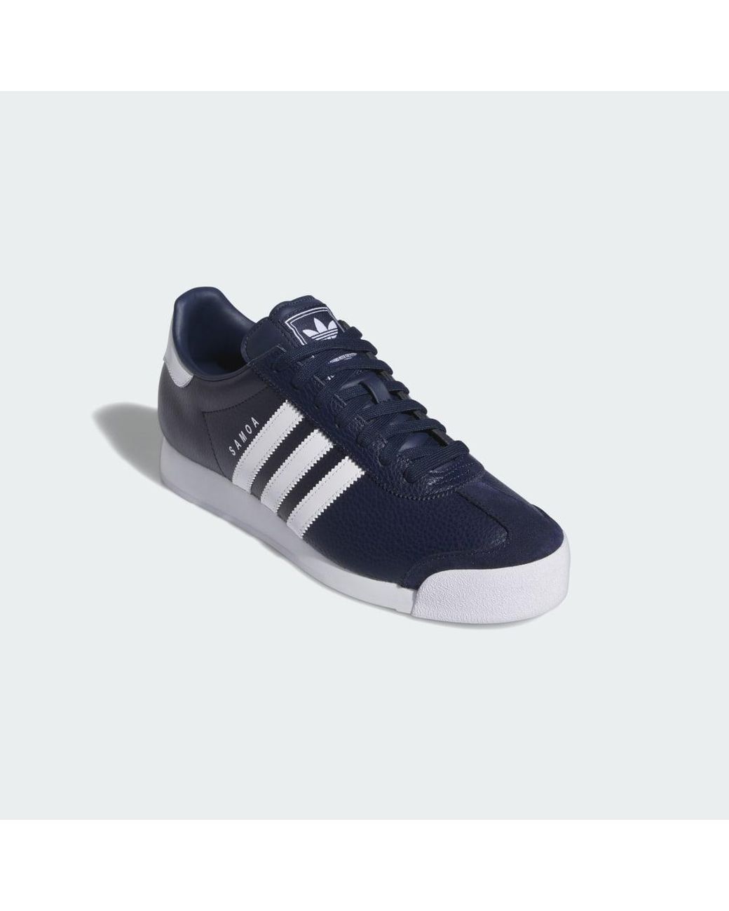 blue and white adidas samoa