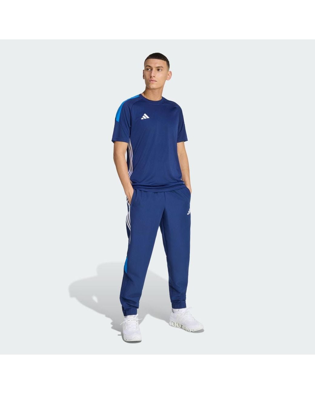 Adidas Blue Tiro 26 Essentials Woven Tracksuit Bottoms for men