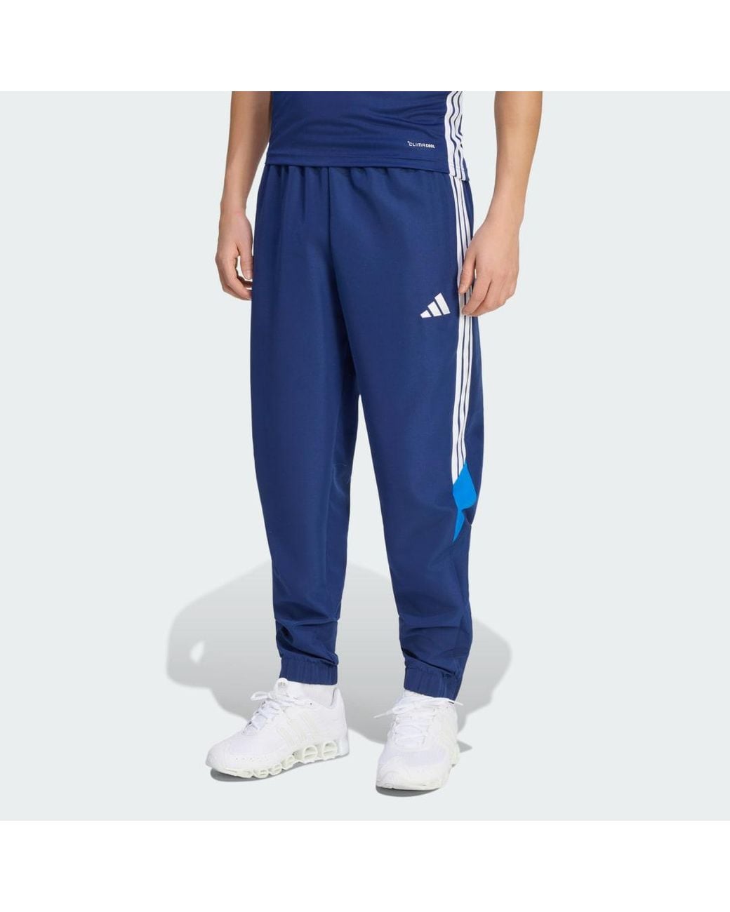 Adidas Blue Tiro 26 Essentials Woven Tracksuit Bottoms for men