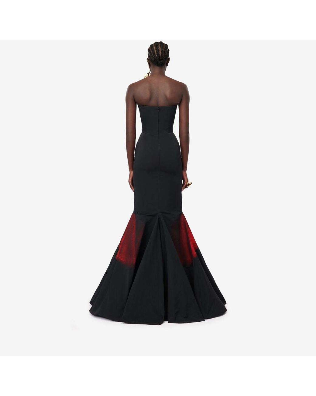 alexander mcqueen black and red dress AlexConsani wears McQueen Spring Summer 2026 slashed bustier dress in red and black skull printed silk chiffon. @Sean.McGirr wears McQueen Autumn Winter 2025 to The #FashionAwards 2025, Royal Albert Hall, London.