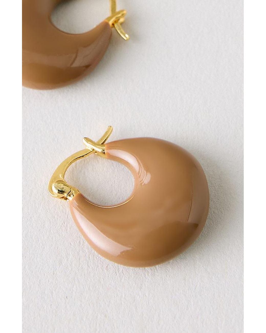 By Anthropologie White Resin Hoop Earrings