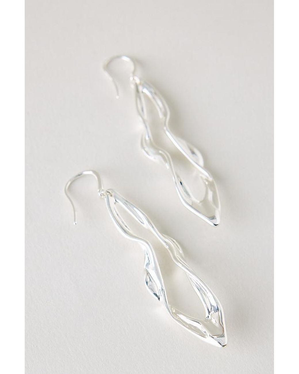 By Anthropologie White Plated Molten Drop Earrings