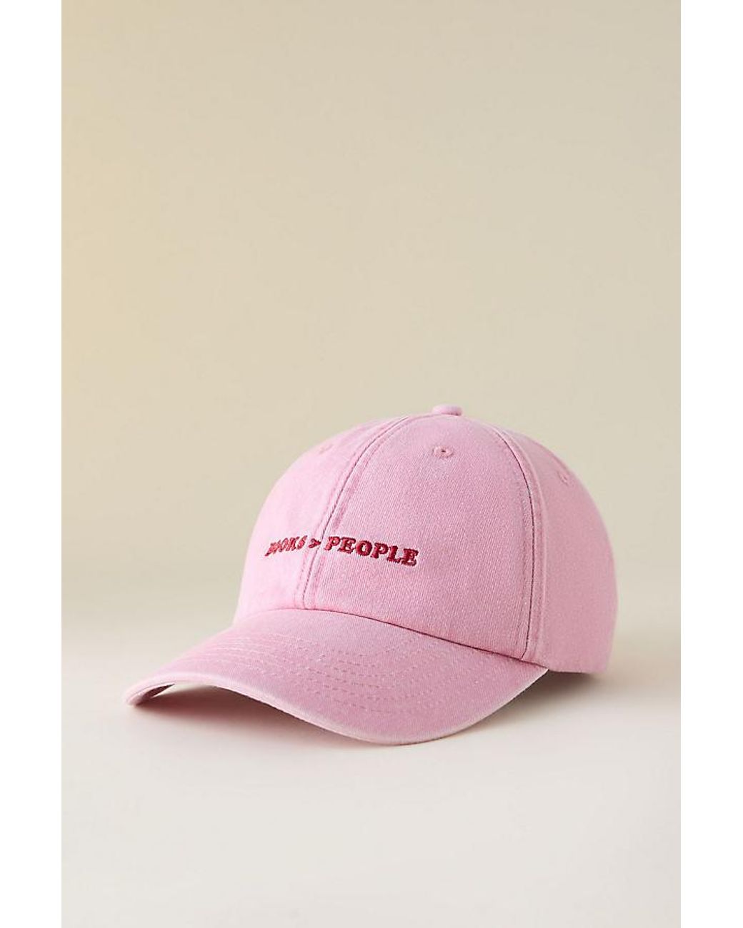 By Anthropologie Pink Books Over People Embroidered Baseball Cap