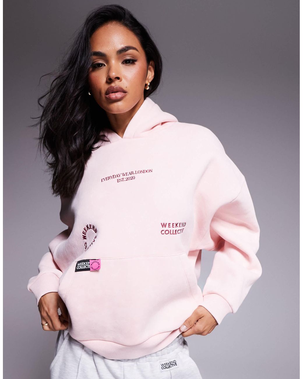 ASOS Weekend Collective Hoodie With Bright Label Detail in Pink | Lyst