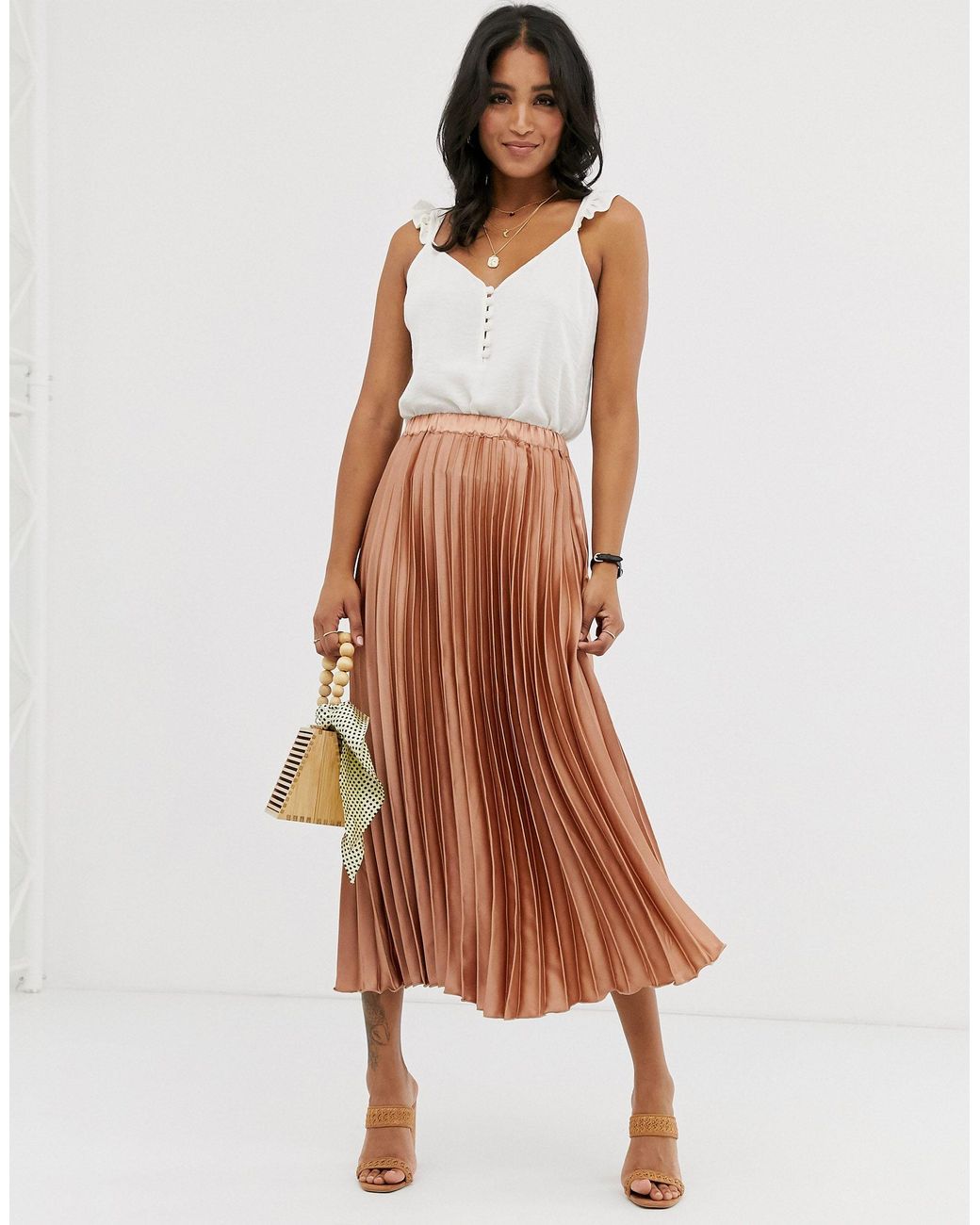 Metallic Satin Pleated High Waisted Midi Skirt in Rose Gold  One Nation  Clothing Metallic Satin Pleated High Waisted Midi Skirt in Rose Gold