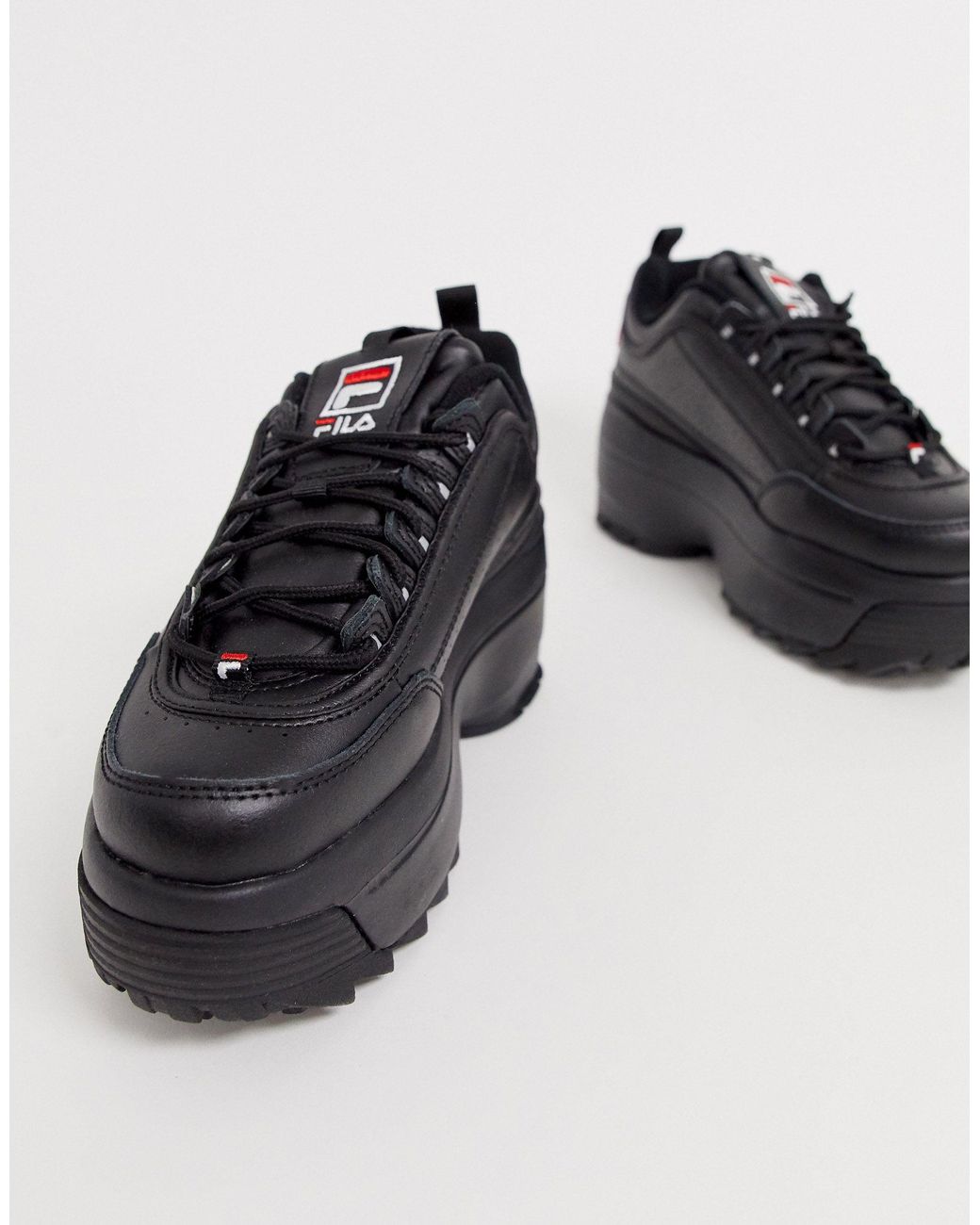 Fila black disruptor sales ii platform trainers
