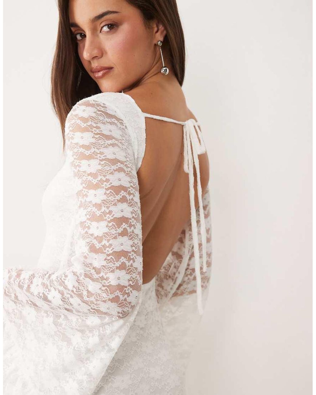 The Frolic White Exclusive Boat Neck Open Back Frill Sleeve & Hem Mini Dress