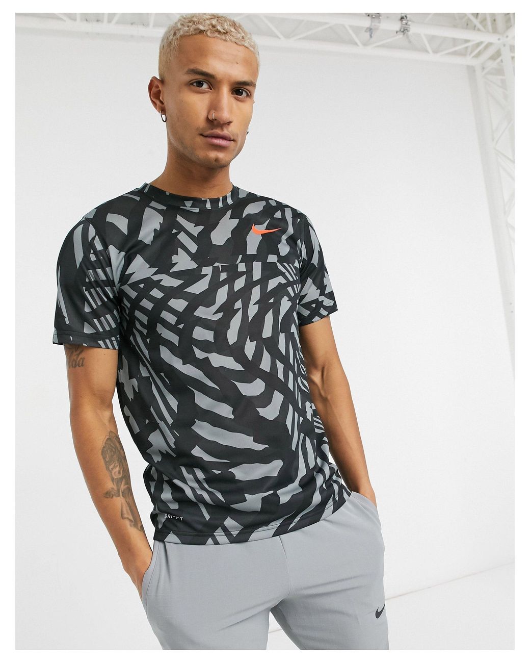 nike all over logo print tracksuit in camel