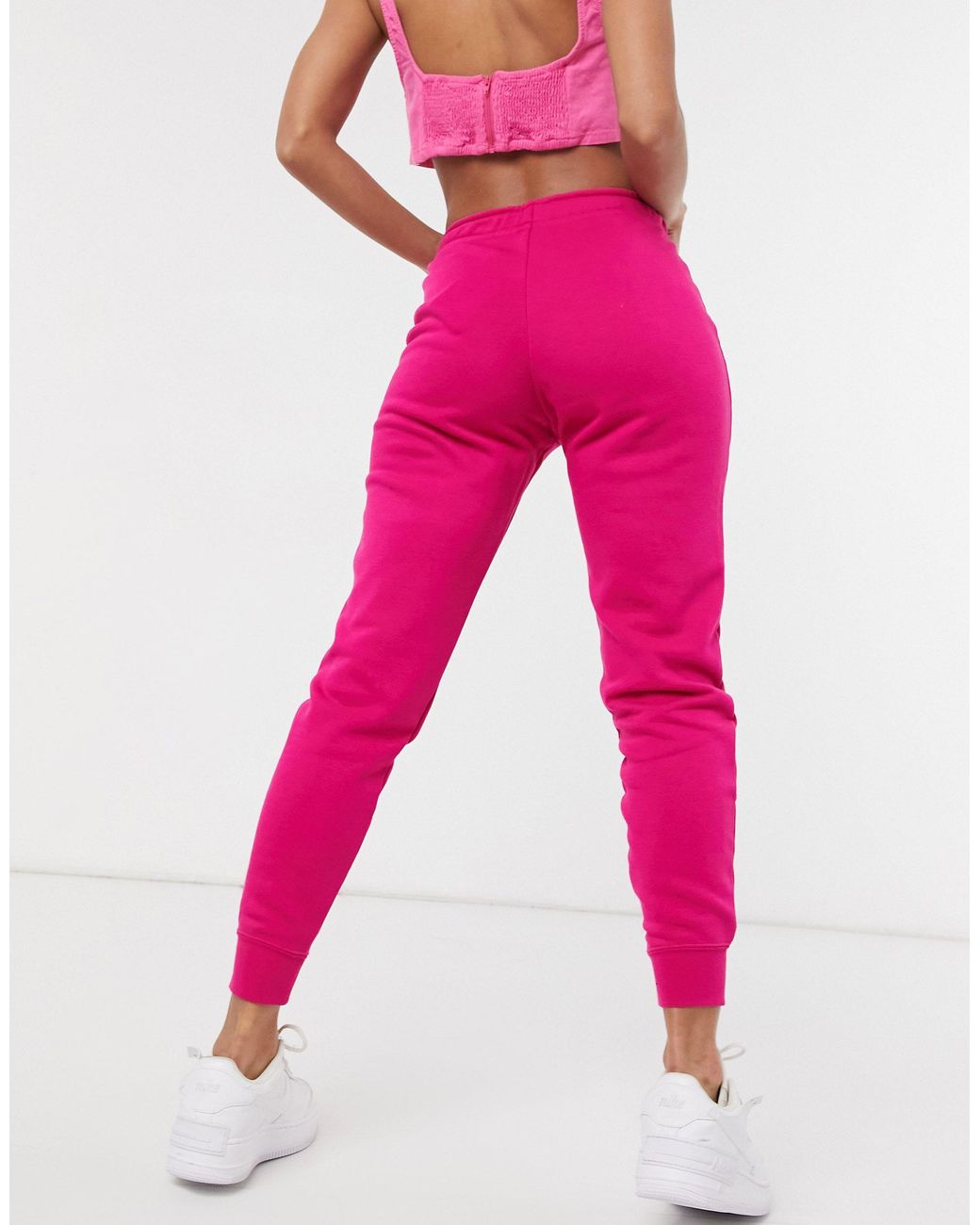 Nike Essential Tight Fit Fleece joggers in Pink | Lyst Australia
