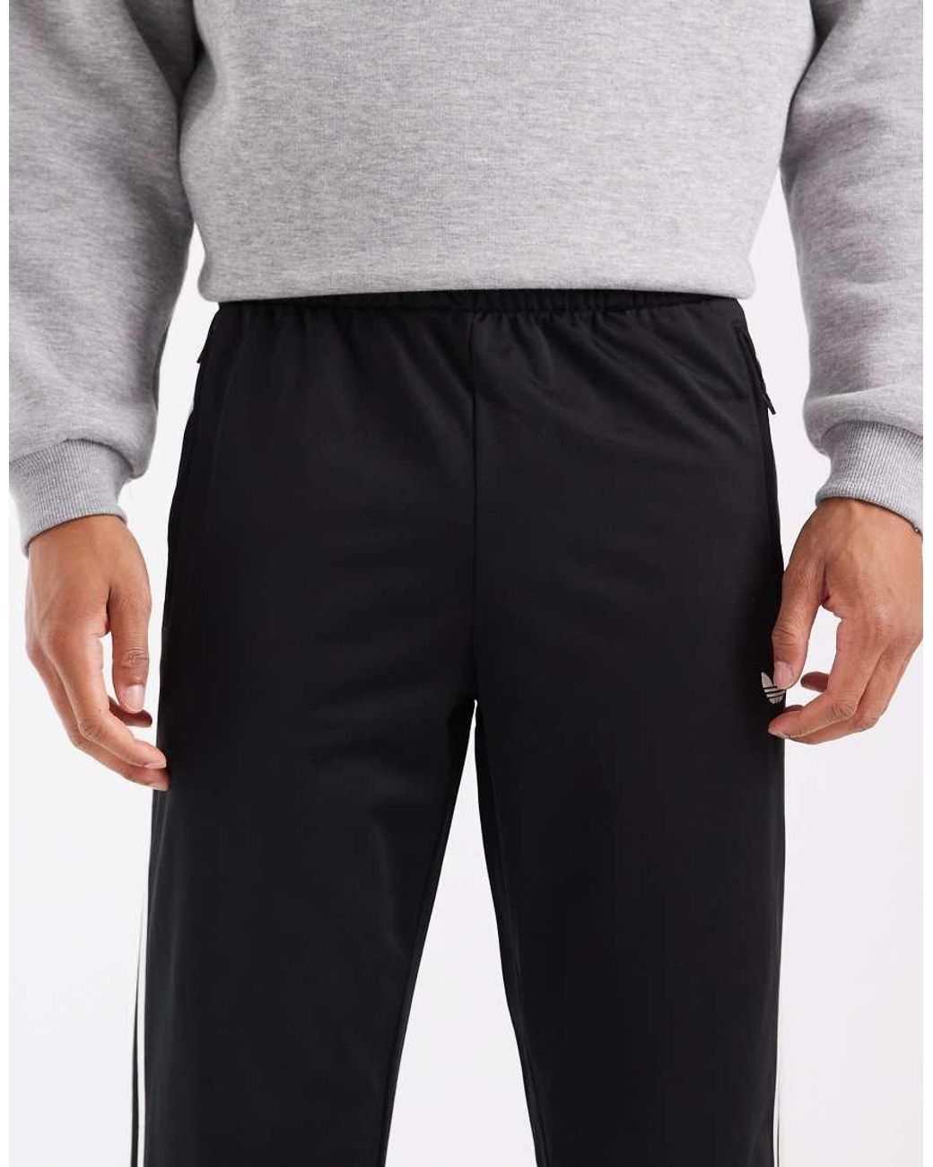 Adidas Originals Black Firebird Trackpants for men