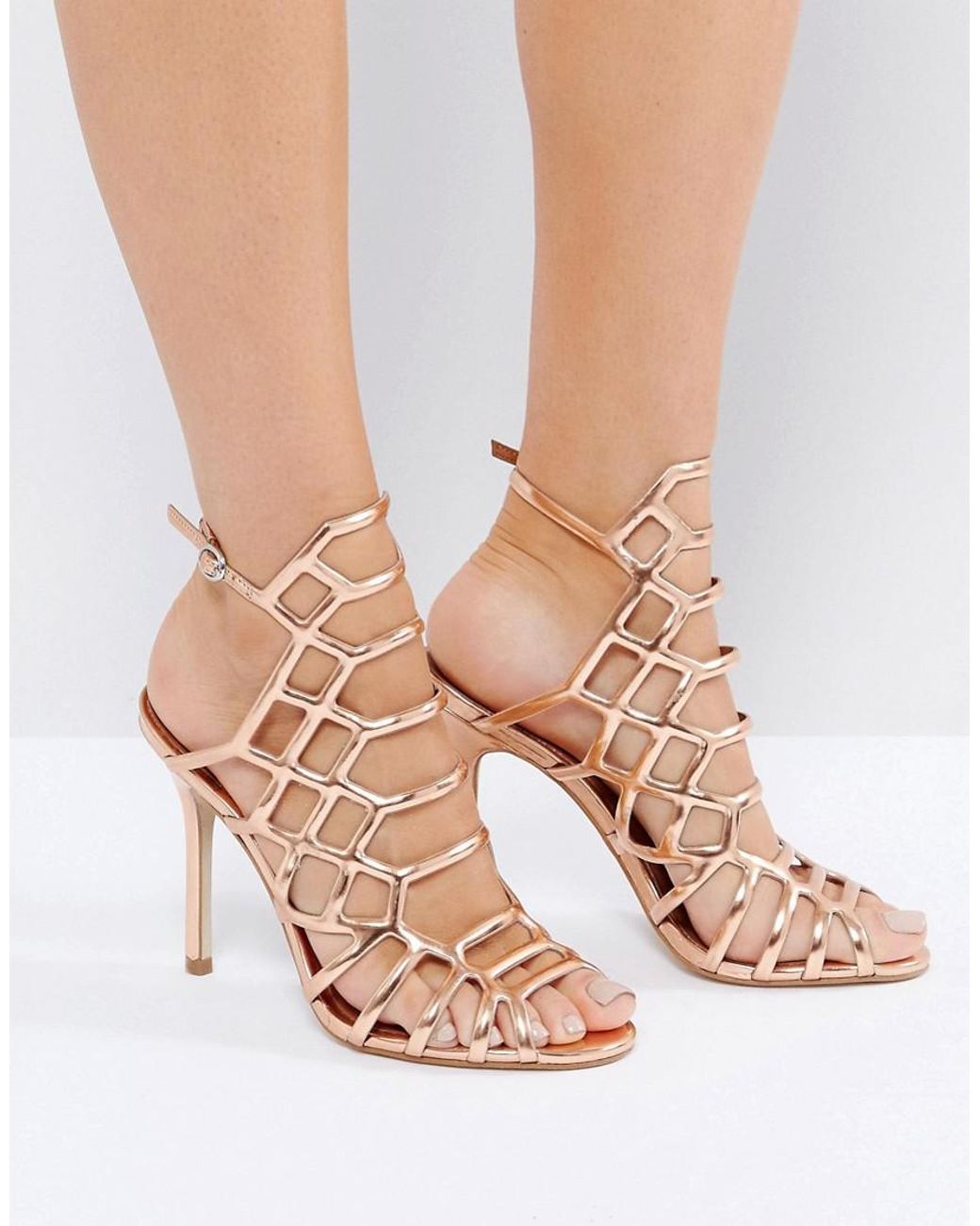 Steve Madden Slithur Rose Gold Caged Heeled Sandals in Metallic | Lyst