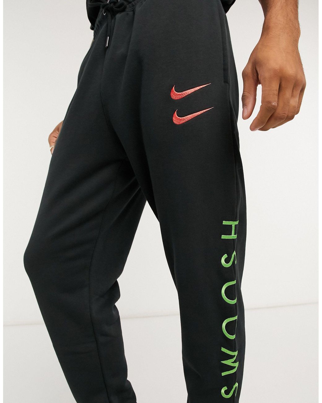 Nike Swoosh Cuffed Sweatpants in Black for Men | Lyst