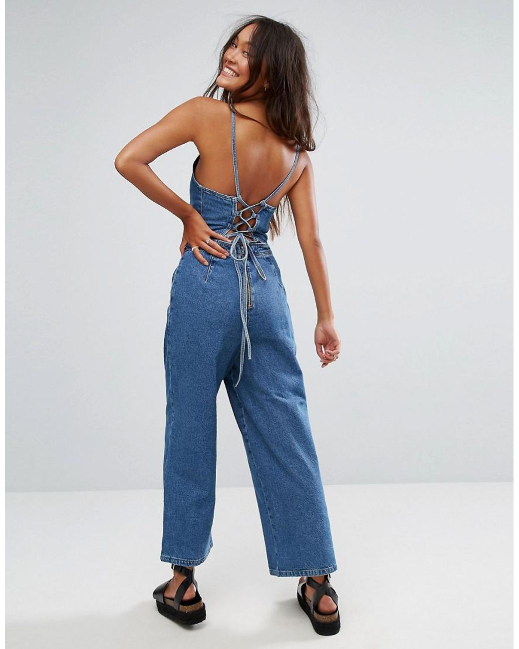 ASOS DESIGN structured halter jumpsuit with tie waist detail in