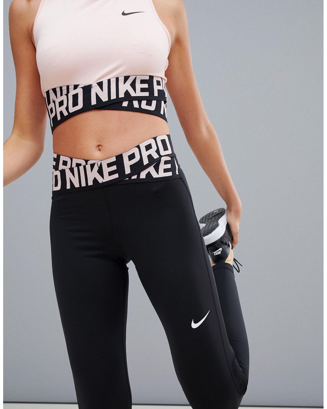 Nike Nike Pro Training Crossover Leggings In Black And Pink | Lyst