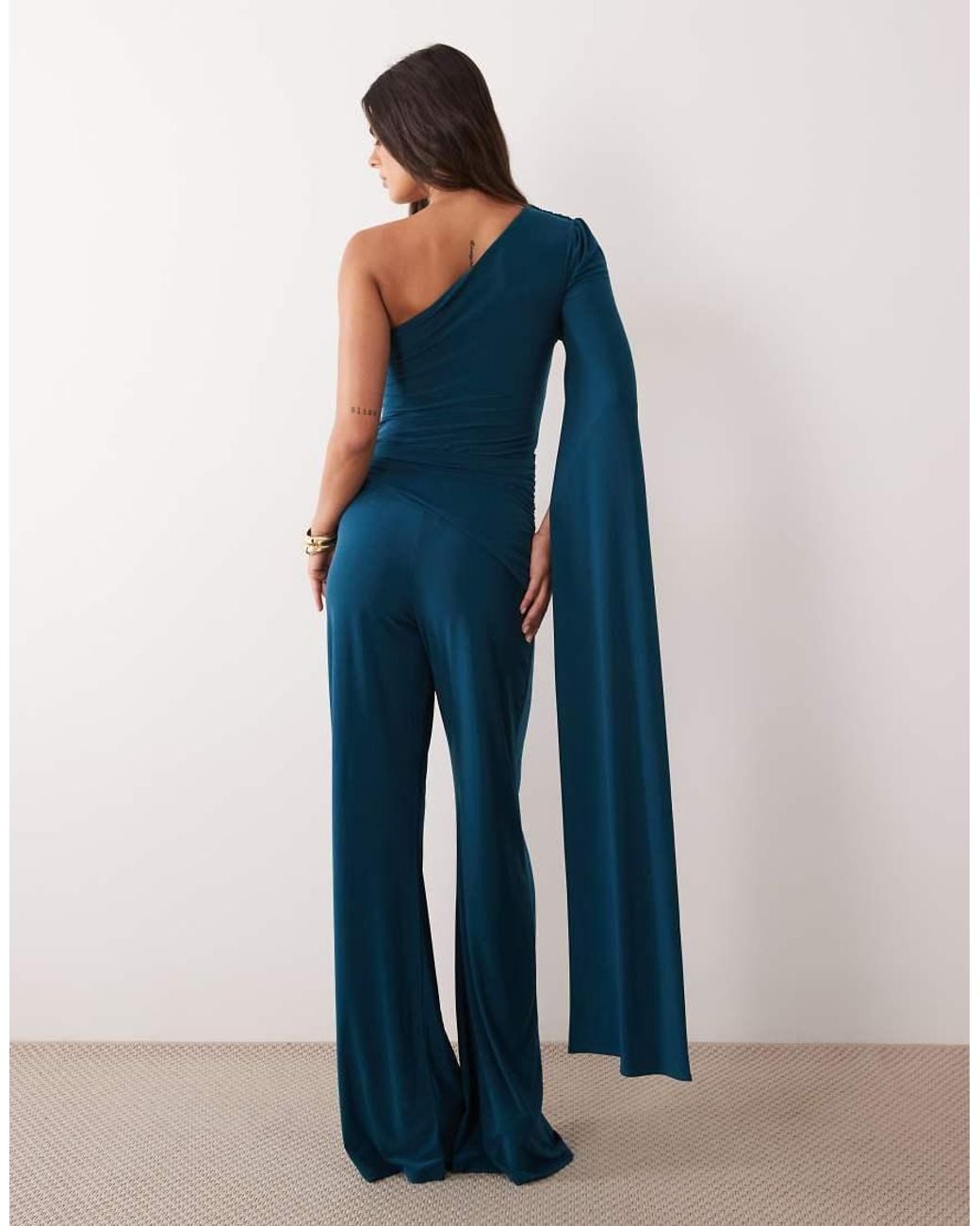 ASOS Blue Asymmetric One Shoulder Jumpsuit With Sash Cape Detail And Tie