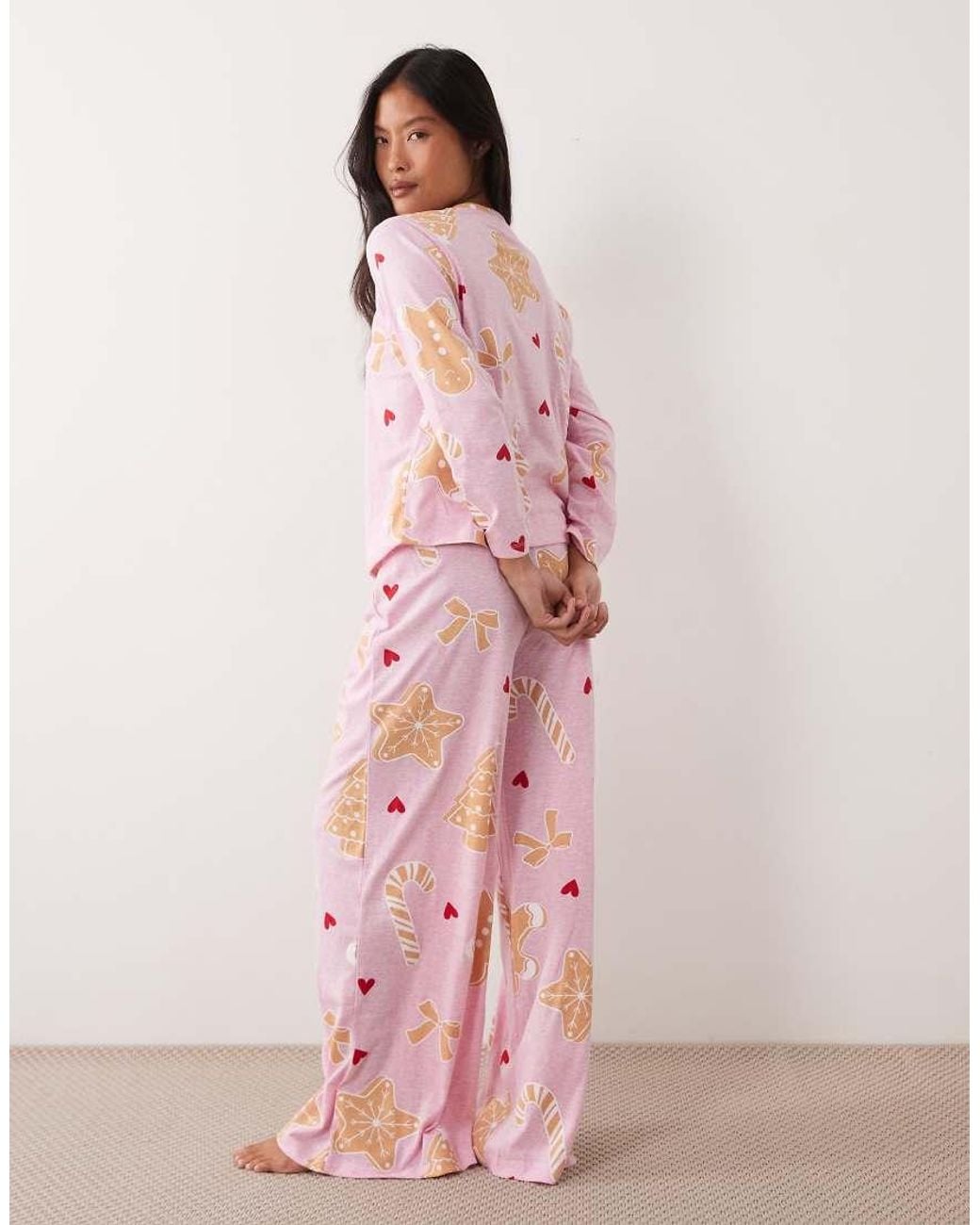 ASOS Pink Asos Design Petite Long Sleeve Top & Wide Leg Trouser Pyjama Set With Sweets Graphic