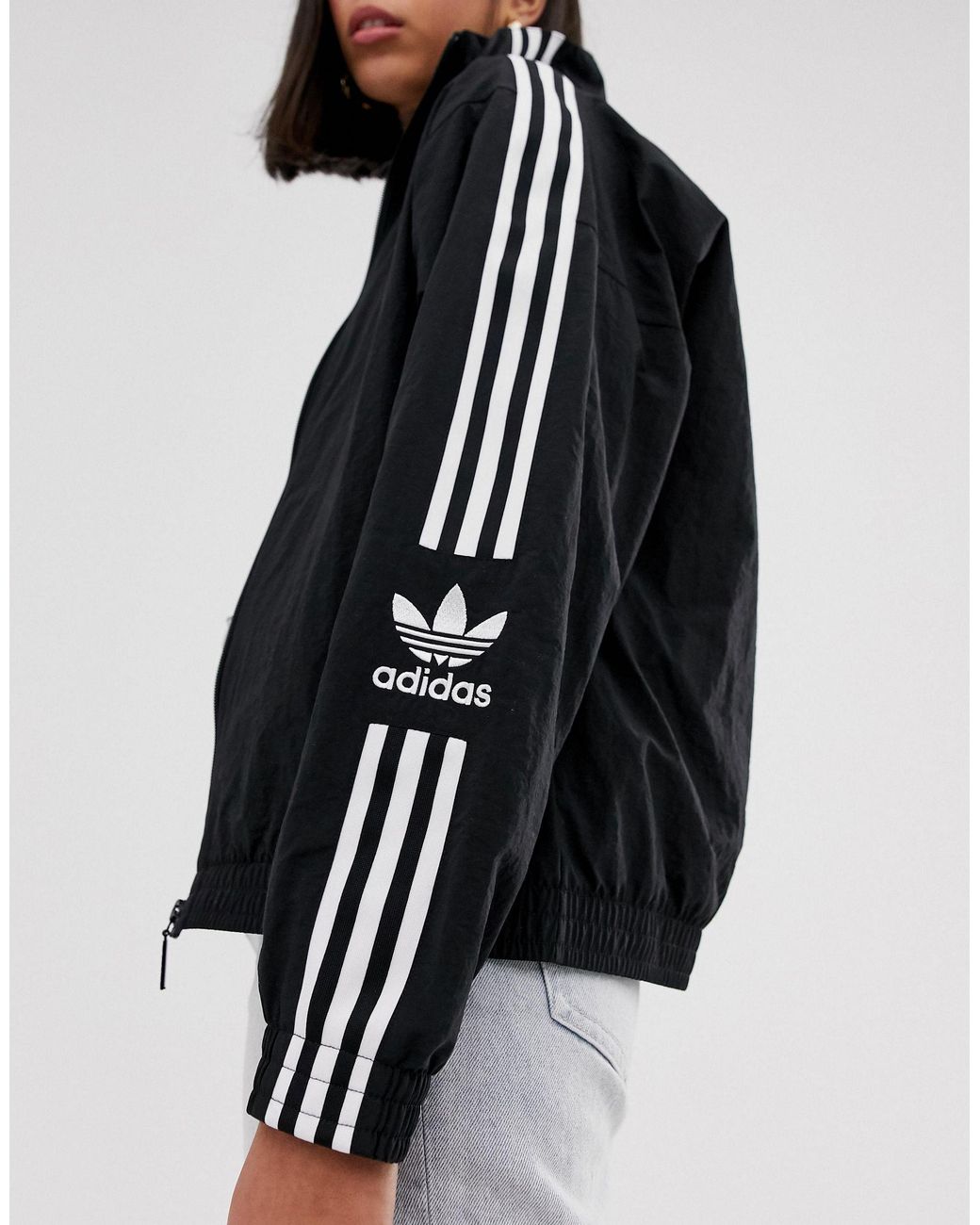 adidas originals locked up logo track jacket in black