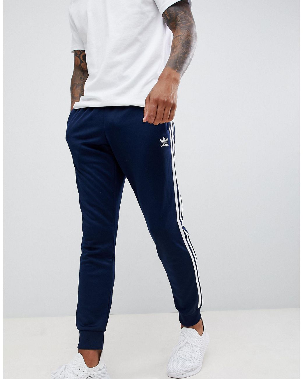 adidas Originals Men's Blue Three Stripe Skinny Sweatpants With Cuffed Hem