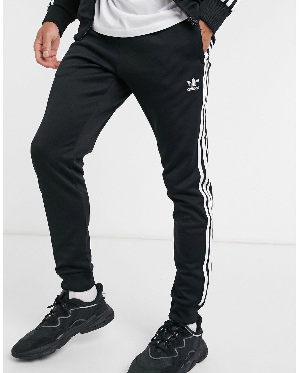 adidas Originals Adicolor Three Stripe Skinny joggers in Black for Men ...